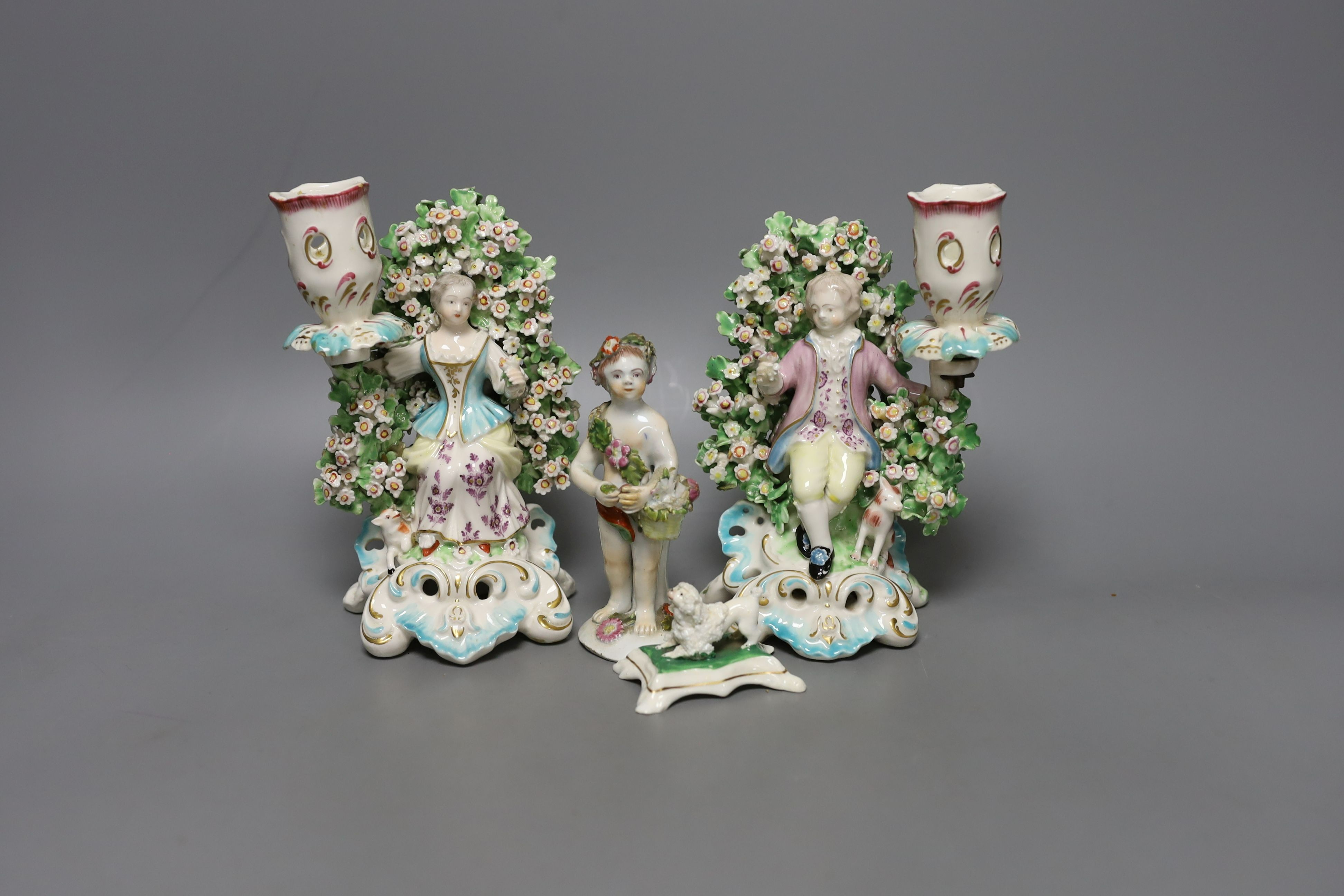 A pair of Derby bocage candlestick figures, c.1775, 17cm tall, a Bow cherub figure, c.1760 and a Staffordshire poodle (4)